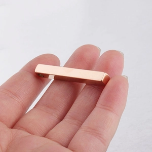 Rose gold polished stainless steel rectangular pillar pendant shown held in hand