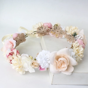Romantic bridal flower crown with pink and beige floral accents for wedding photography