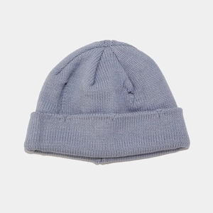 Detailed close-up of gray-blue knitted beanie showing soft ribbed texture and cuffed hem