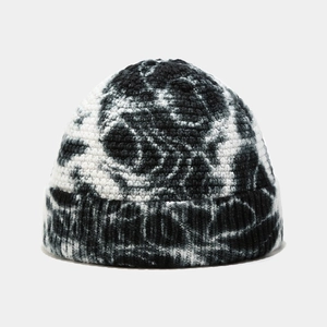 Detailed view of the black and white tie-dye knit texture on this winter docker hat
