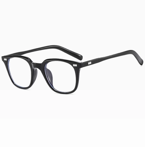 Detail view of black full-rim glasses frame with blue light blocking lenses and silver studs