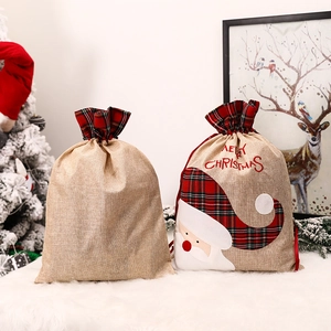 Christmas burlap gift bags with Santa embroidery and festive plaid drawstring design