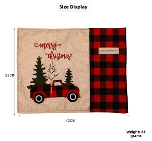 Detailed view of Merry Christmas placemat with red truck and plaid linen texture