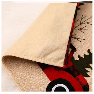 Close-up of red plaid Christmas placemat showing linen texture and cream felt backing