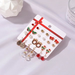12-pair Christmas earring set with Santa, bells and trees on festive card display