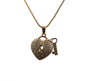 Gold necklace with heart lock and key pendant featuring sparkling pavé crystals