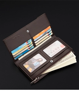 Macro shot of a coffee brown leather wallet showing multiple card slots and cash compartments