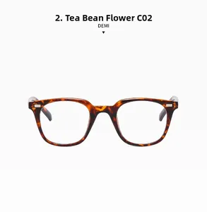 Detail of retro square demi-patterned glasses frame with classic metal rivet accents