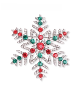Detail showing Christmas snowflake brooch with red and green rhinestones, 50mm x 50mm size
