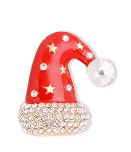 Close-up of red enamel Christmas hat brooch with gold stars and white rhinestones