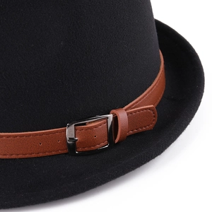 Detail of black wool felt fedora featuring a brown leather band and silver buckle