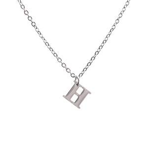 Minimalist silver stainless steel necklace featuring a brushed metal letter H pendant