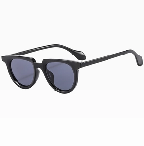 Detail view of vintage black full-rim sunglasses with dark lenses and smooth temples