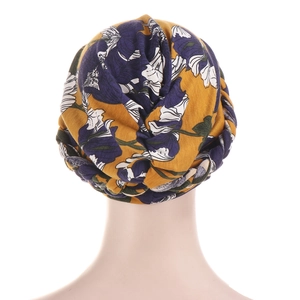 Tie-dye floral turban headscarf with braided trim and knot design on yellow milk silk fabric