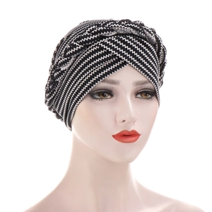 Close-up of black and white zigzag pattern turban with braided twist knit detail