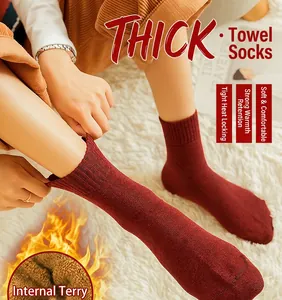 Close-up of thick wine red thermal terry socks with warm inner loop texture
