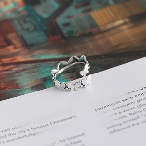 S925 sterling silver beaded butterfly open ring on vintage book page background