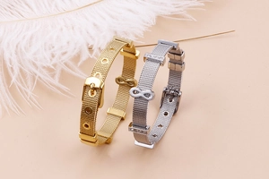 Detail of adjustable 18k gold and silver plated infinity mesh strap bracelets