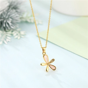 Chic hollow flower sweater chain with pink stones and zircon pendant on a gold necklace