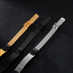 Detailed close-up of mesh stainless steel watch-style bracelets in gold, black and silver