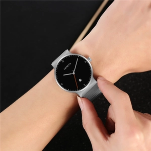 Close-up of Geneva men's watch featuring a black dial and silver mesh steel strap