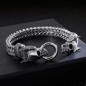 Macro view of punk style skull head clasp with pavé diamonds on double row keel chain