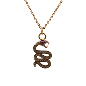 Detail of gold snake necklace with micro-paved zircons and a pink gem for the eye