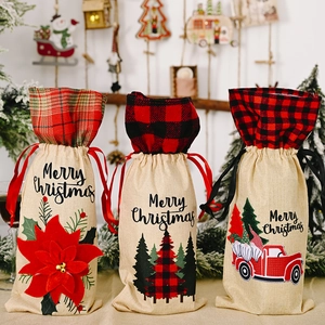 Three burlap wine bags with Merry Christmas prints, red flowers and truck designs