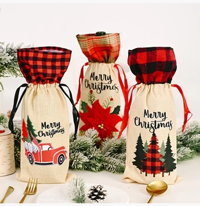 Three Christmas burlap wine bottle bags with truck, flower and tree motifs
