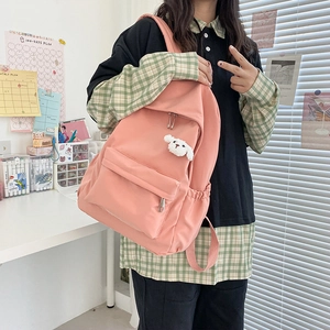 Zaino rosa impermeabile con ciondolo a forma di cucciolo e tasca anteriore