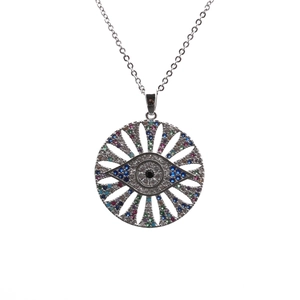 Detailed close-up of a silver Evil Eye pendant with colorful inset gemstones and chain