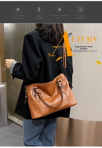 Detailed side view of a brown vintage leather tote bag with reinforced handles and strap