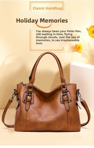 Detail of vintage brown textured Boston bag featuring top handles and metal buckle accents