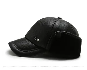 Close-up of black PU leather baseball cap with fleece ear flaps and metal sport tag