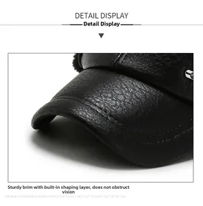 Detail shot of the textured black leather brim with premium double stitching on a winter hat