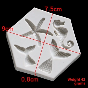 Macro detail of silicone mold showing dimensions of starfish, seahorse and fish tail cavities