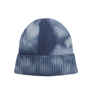 Detail of blue and white tie-dye knit beanie showing rib-knit texture and cuffed design