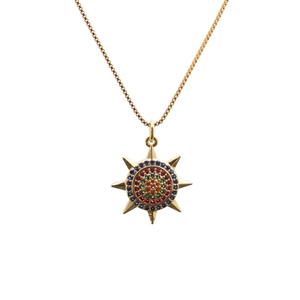 Gold necklace with sunburst pendant featuring colorful micro-pave cubic zirconia stones