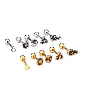Set of surgical steel stud earrings featuring triangle and wing designs in gold and silver