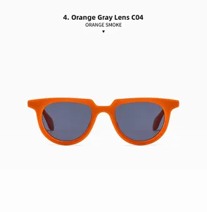Detail of trendy small frame sunglasses in orange smoke finish with dark grey lenses