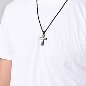 Men's antique bronze brushed stainless steel cross necklace worn on neck by a male model