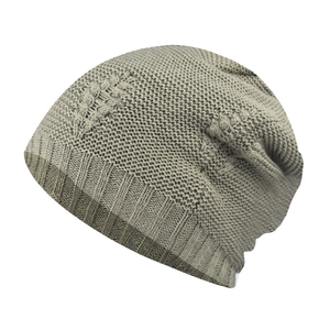 Detail of grey winter knit beanie showing rhombus pattern and ribbed cuff for men and women