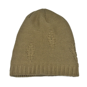 Detail of khaki winter knit beanie showing embossed leaf patterns and ribbed cuff texture