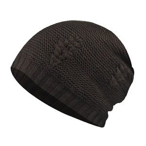 Detail of winter beanie featuring embossed leaf pattern and ribbed cuff in dark brown