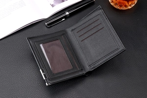 Classic black leather bi-fold wallet interior with clear ID window and card slots in business setting