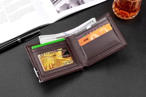 Brown leather wallet interior detail with multiple card slots and cash compartment