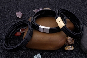 Detail of multi-layer braided leather bracelets with stainless steel magnetic clasps