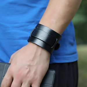 Vintage black wide leather cuff bracelet for men with adjustable straps on wrist