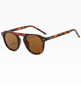Detail view of tortoiseshell aviator sunglasses with metal rivets and double bridge