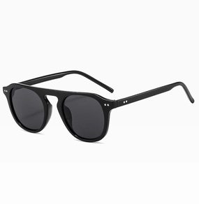 Detail view of black vintage pilot sunglasses featuring silver rivets on the frame corners